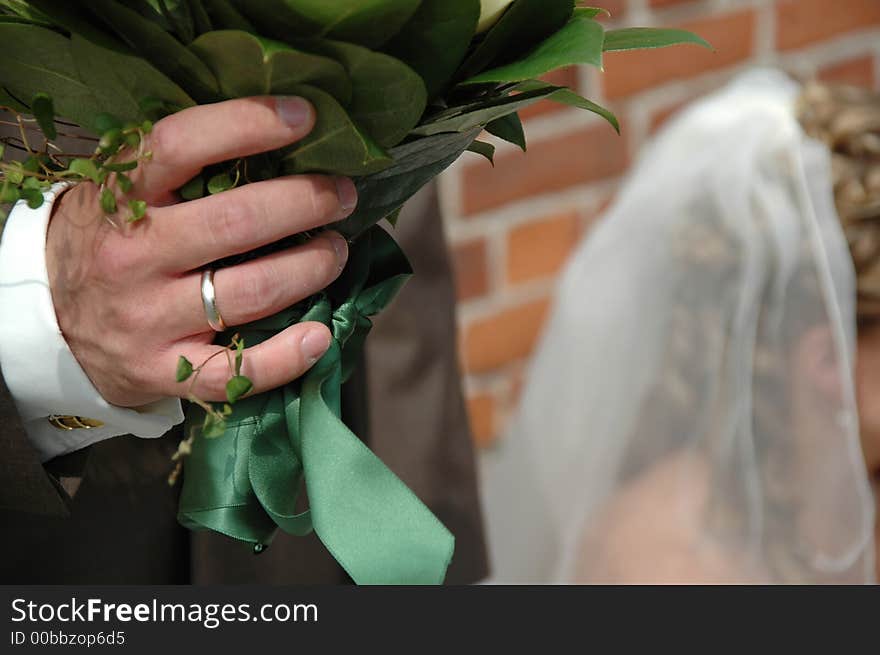 Groom Holding Flowers