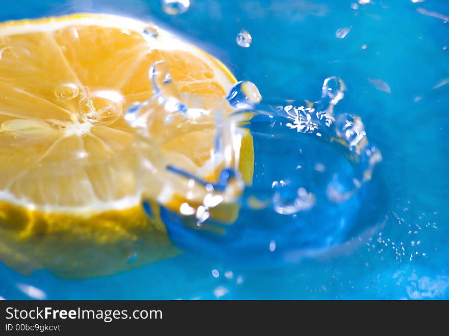 Lemon fruit on the water with blue background. Lemon fruit on the water with blue background