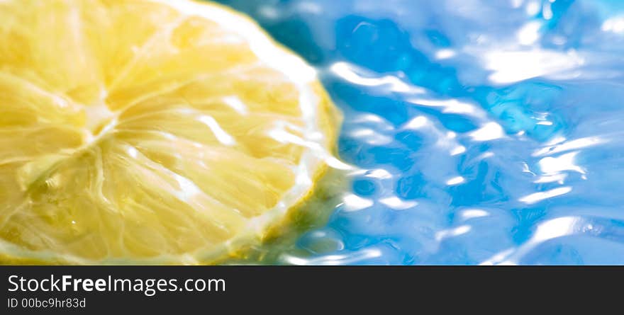 Lemon fruit on the water with blue background. Lemon fruit on the water with blue background