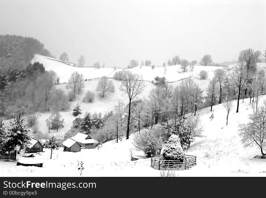 Black and white village under snow. Black and white village under snow