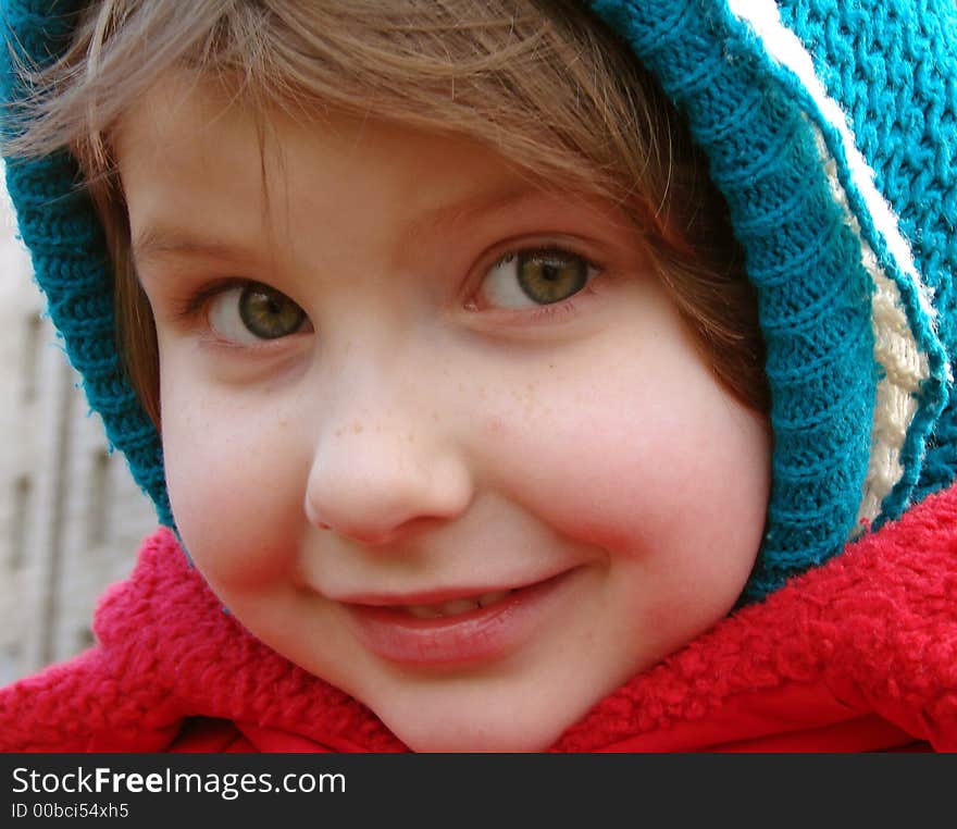 Little smiling girl wintertime outdoor portrait. Little smiling girl wintertime outdoor portrait