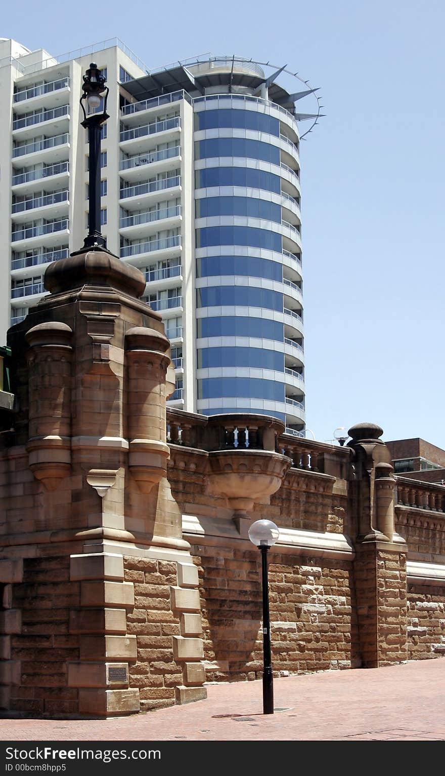 Modern Urban Building Behind An Old Brick Wall, Sydney City, Australia. Modern Urban Building Behind An Old Brick Wall, Sydney City, Australia