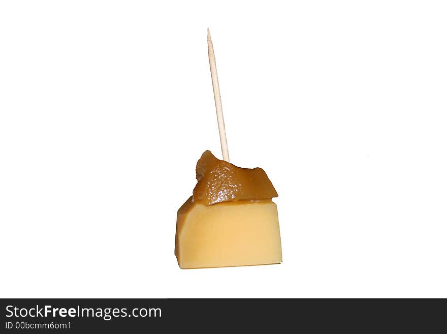 Cube of edam cheese with ginger on top. Cube of edam cheese with ginger on top