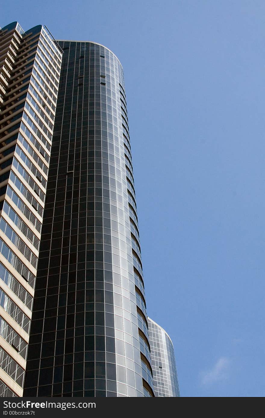 Modern skyscrapers against a bright blue sky