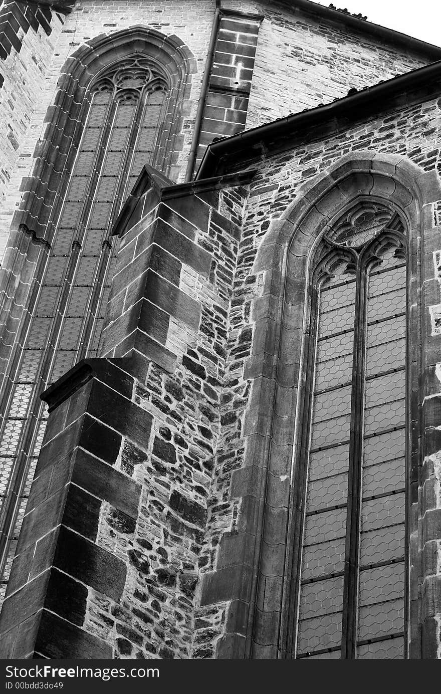 A black and white image of a cathedral wall. A black and white image of a cathedral wall