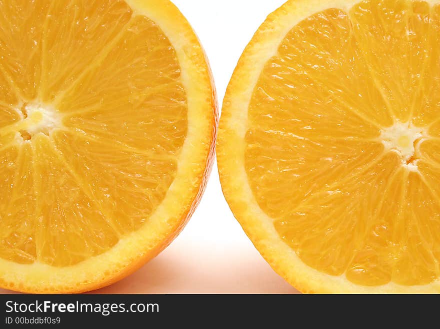 Shot of two orange halfs upclose. Shot of two orange halfs upclose