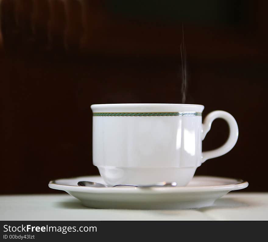 Cup of warm coffee with sugar on the black background. Cup of warm coffee with sugar on the black background