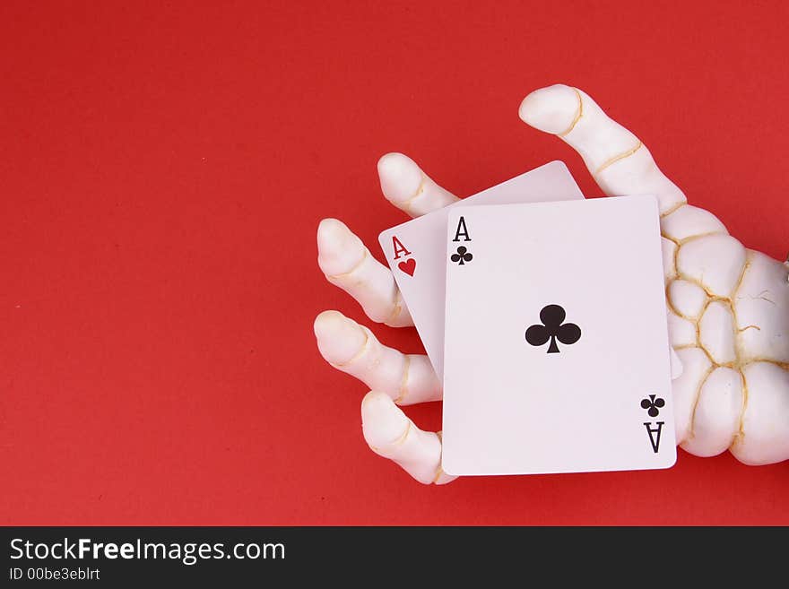 Pair of Aces in the hand of Death with text space on left side of image. Pair of Aces in the hand of Death with text space on left side of image.