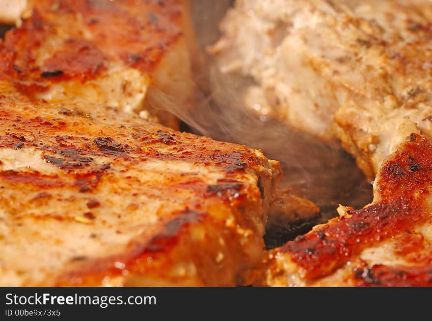 Pork big steak cooked (real time shot you can see the smoke and the bubbles from oil)