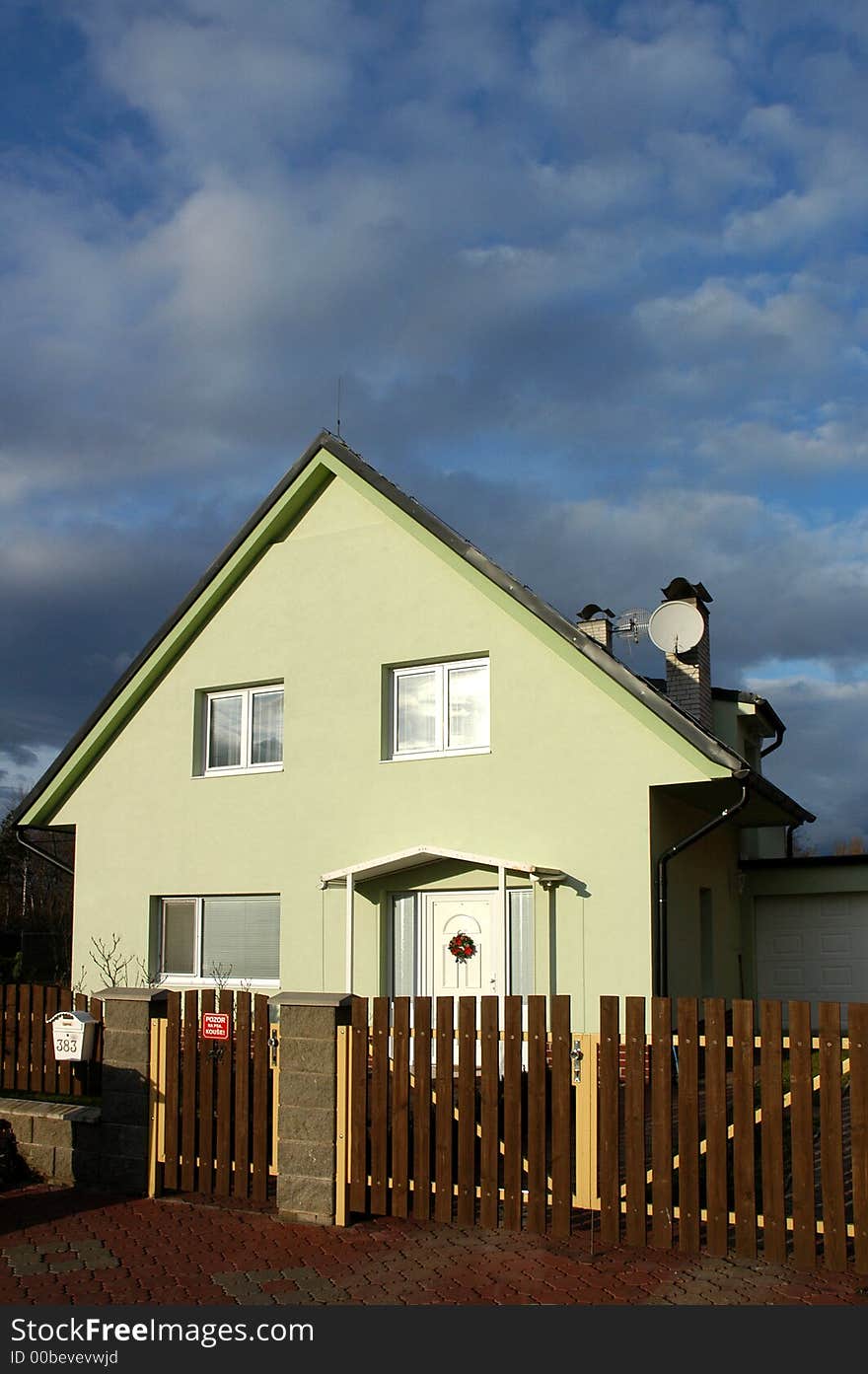 Green house in cloudy afternoon