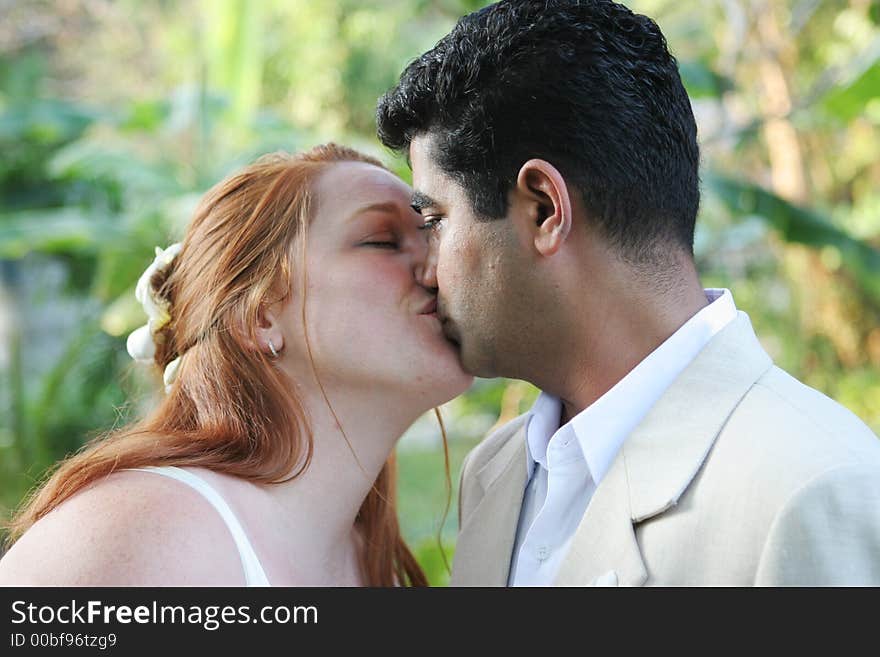 Couple kiss on their wedding day. Couple kiss on their wedding day