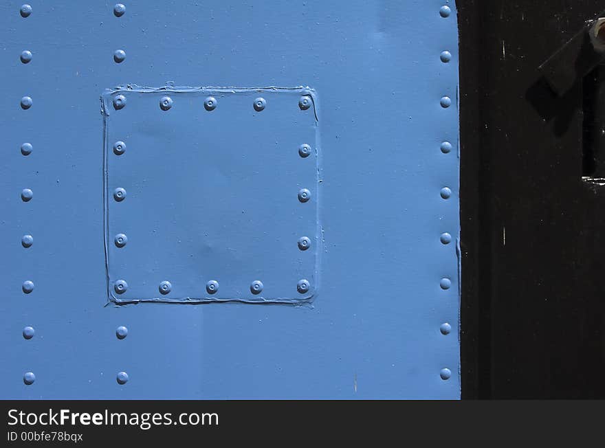 Detail from an blue container with rivets. Detail from an blue container with rivets