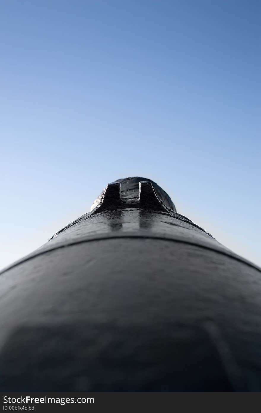 Old black cannon and blue sky as background. Old black cannon and blue sky as background