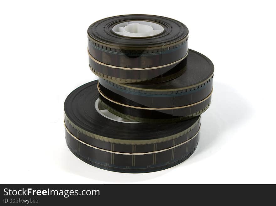 A stack of three 35mm movie film trailers - on white. A stack of three 35mm movie film trailers - on white