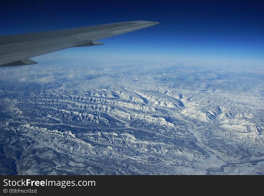 Aerial view of snow clad mountain from the plane. Aerial view of snow clad mountain from the plane