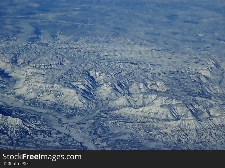 Aerial view of snow clad mountain from the plane. Aerial view of snow clad mountain from the plane