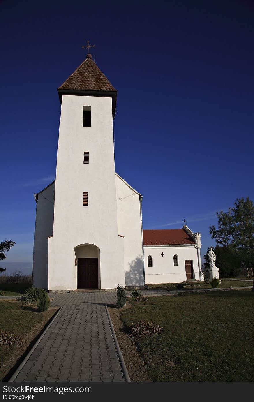 Small villager church with white walls