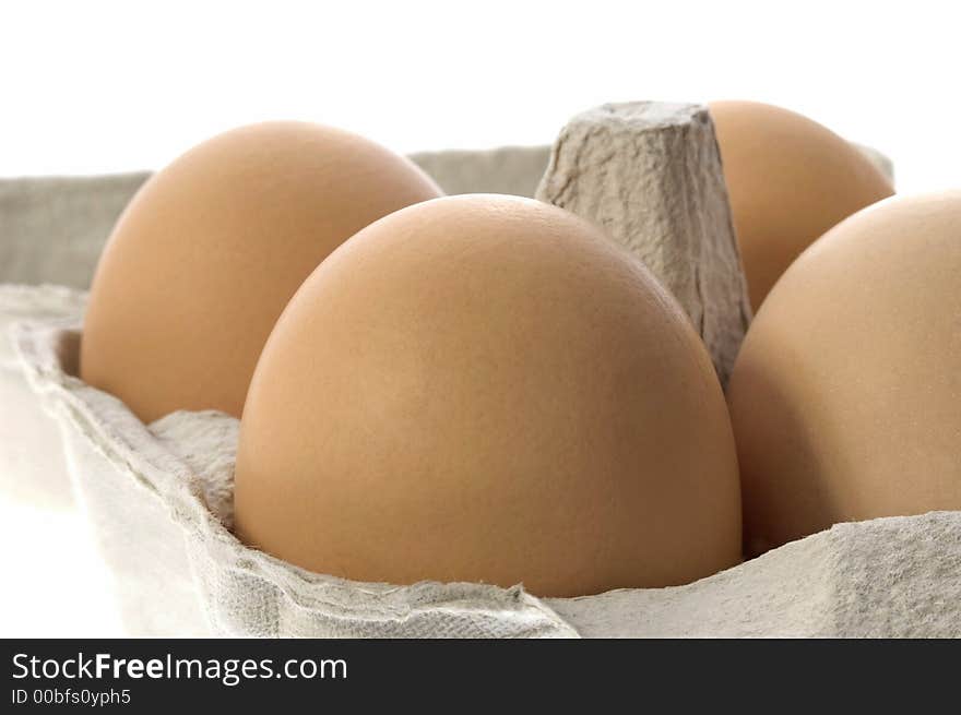 Eggs in a grey cardboard carton boxeggs isolated on the white background