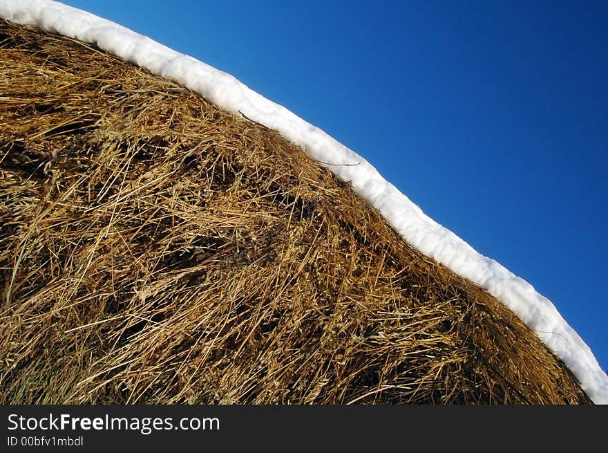 A hay is snow and blue sky. A hay is snow and blue sky