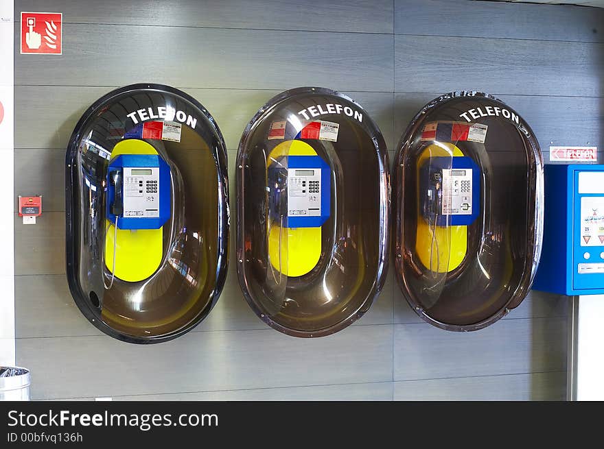 3  public phone boxes at the airport