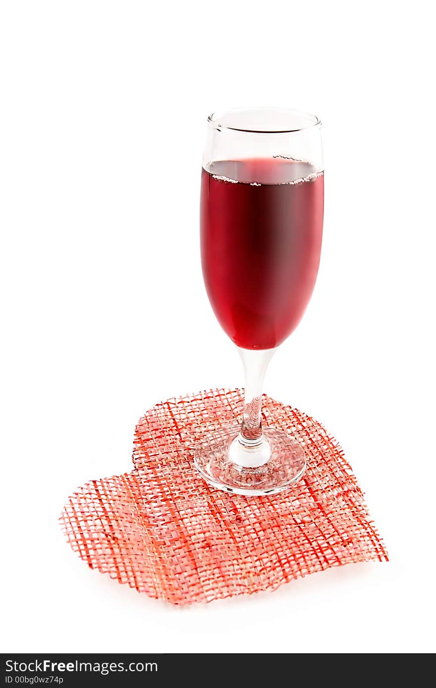 Glass of red wine on a background of heart