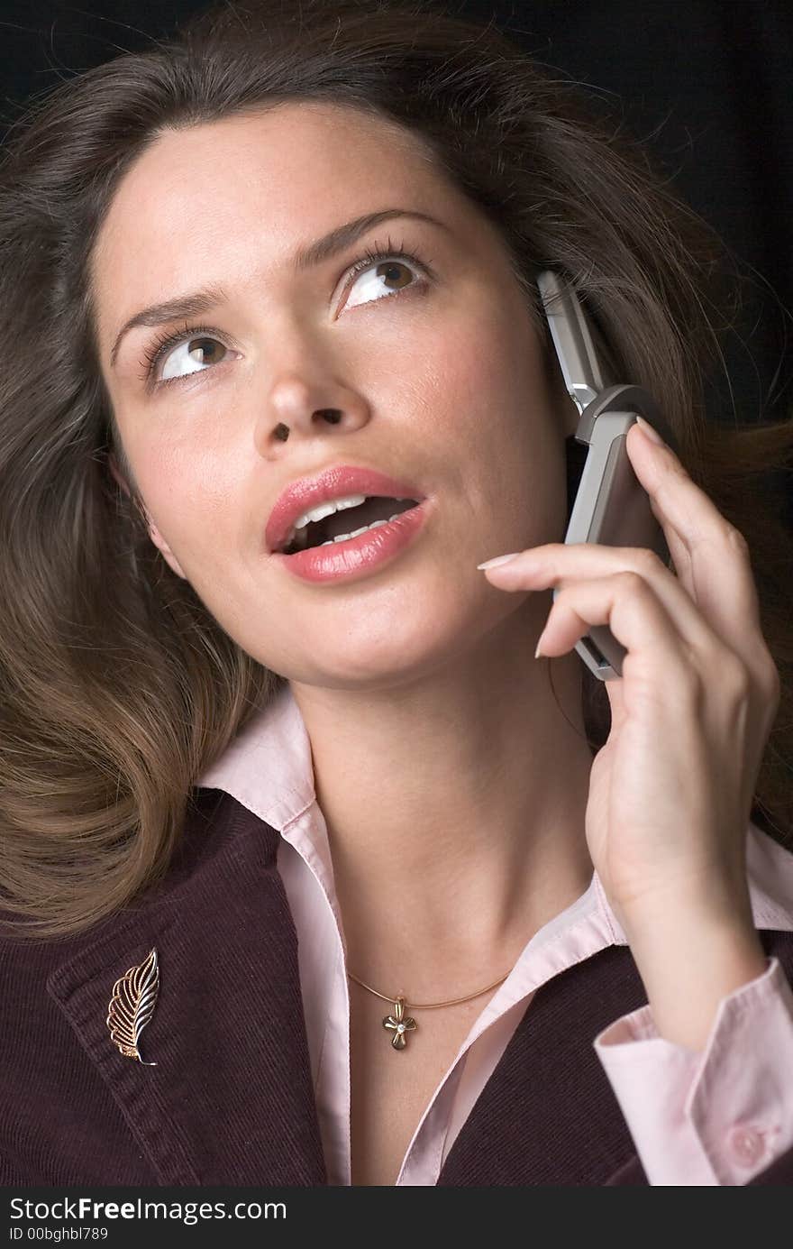 Pretty brunette secretary with telephone headset. Pretty brunette secretary with telephone headset