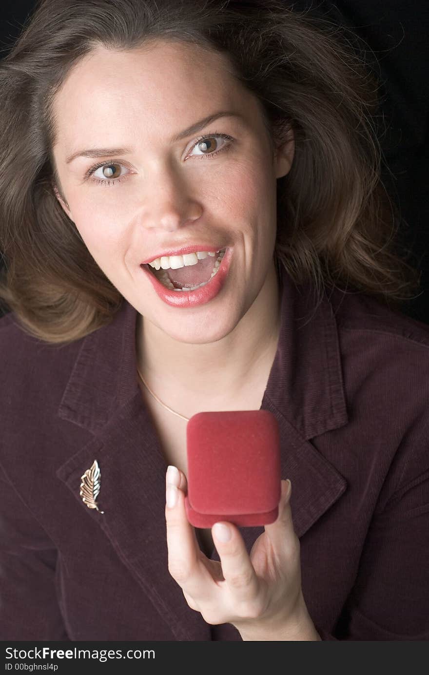 Pretty brunette is very happy to receive a present