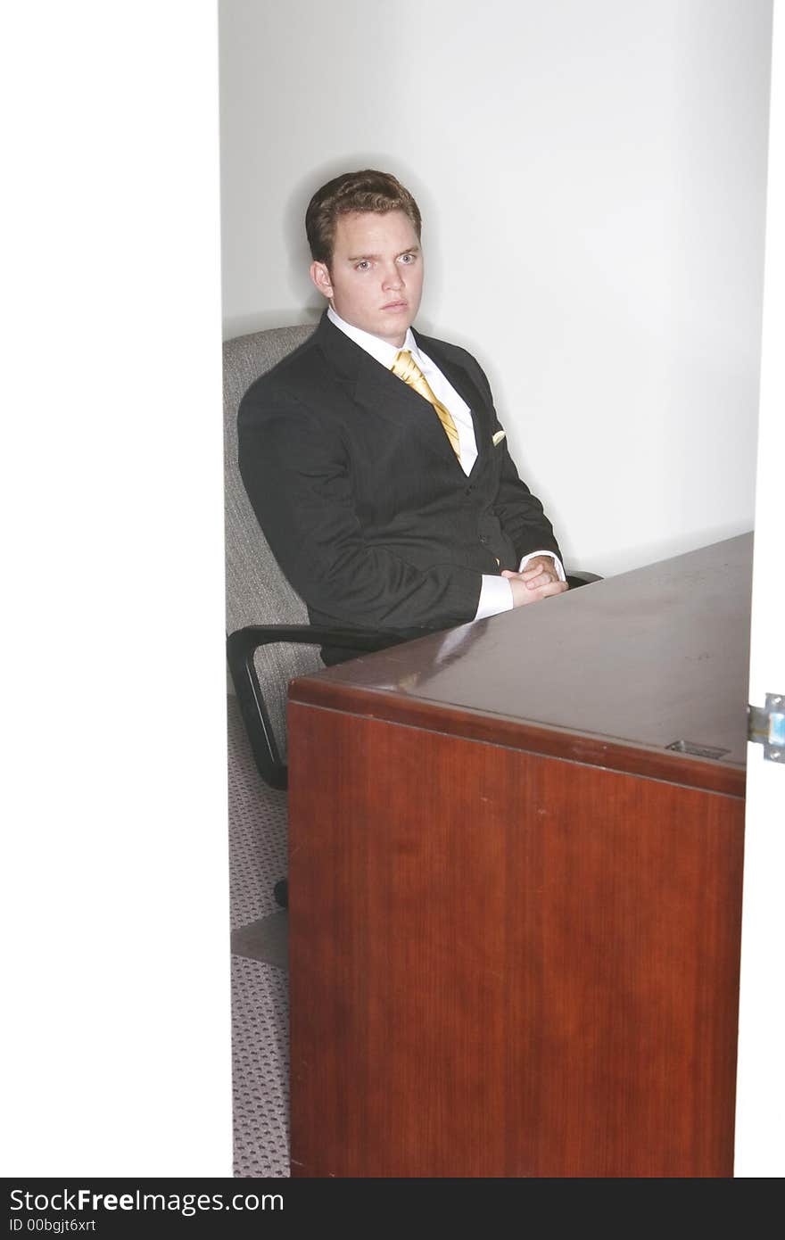 Businessman Looking Out Of His Office