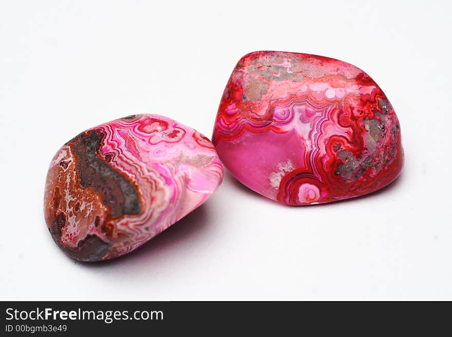 Picture of  a couple red polished stones. Picture of  a couple red polished stones