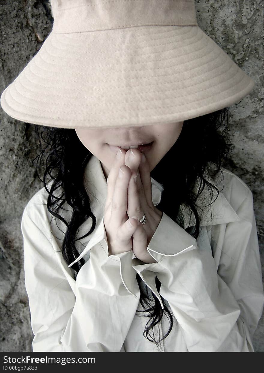 Girl wearing hat covering eyes