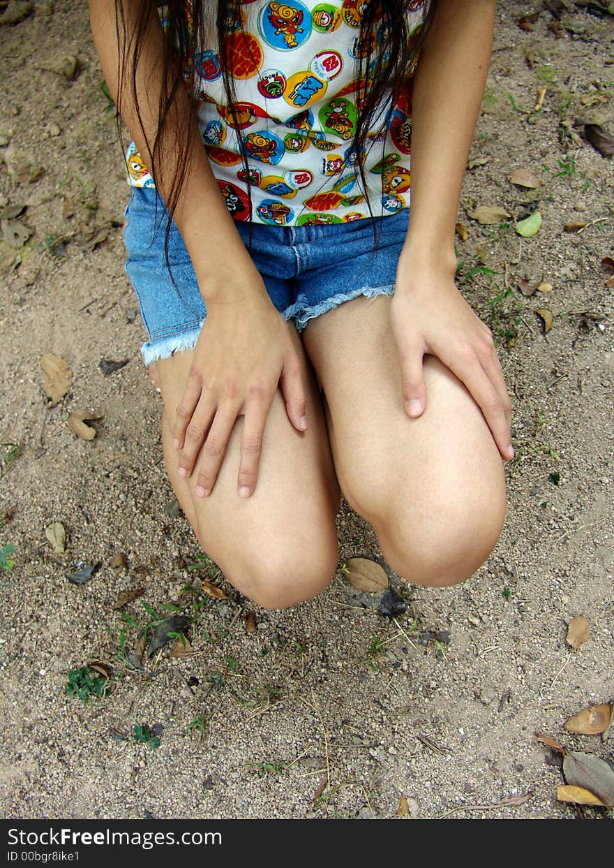 Girl with hands on legs