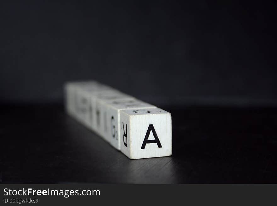 Cubes with letters on a black background. Cubes with letters on a black background