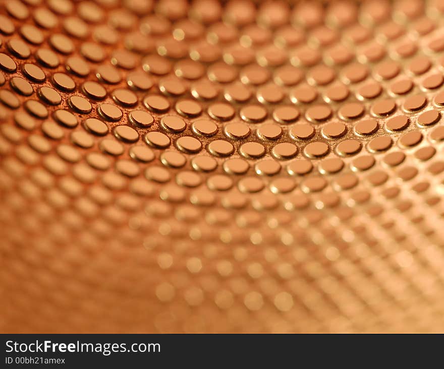 Closed up view of  perforated holes with red background. Closed up view of  perforated holes with red background