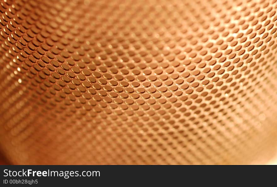 Macro view of perforated holes with red background. Macro view of perforated holes with red background