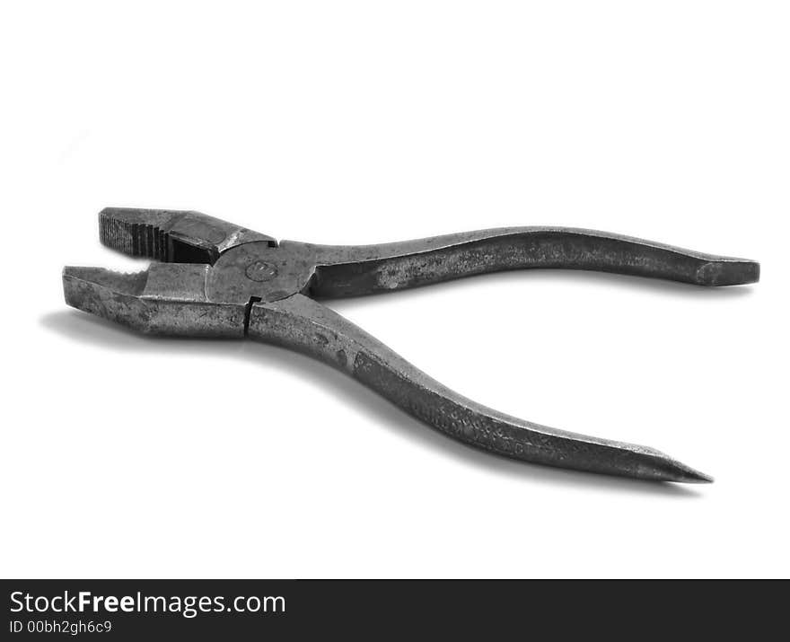 Old metalwork instrument on a white background