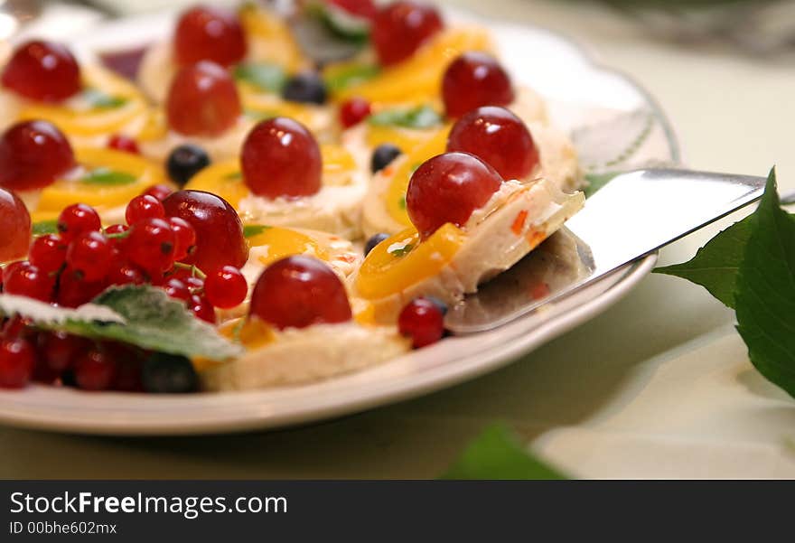 Cake with cherries on the white plate