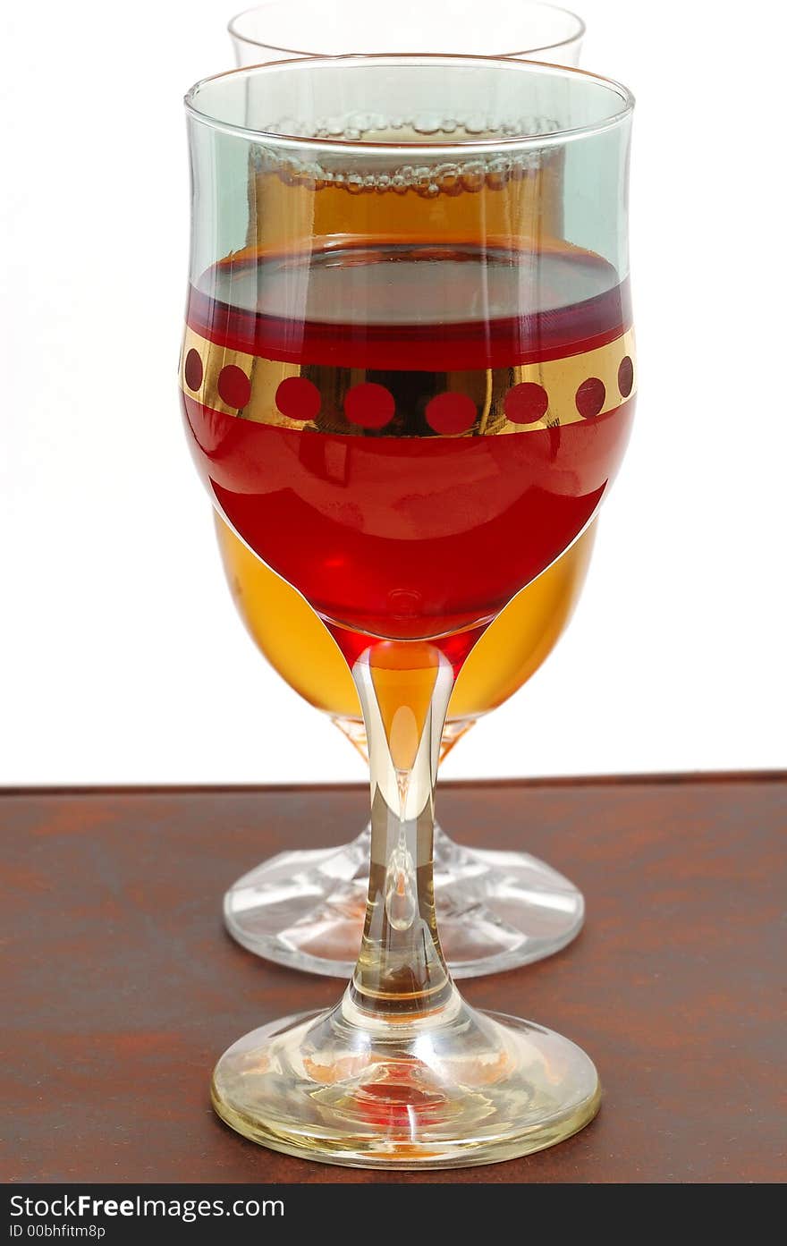 Glasses of wine on a dark brown background