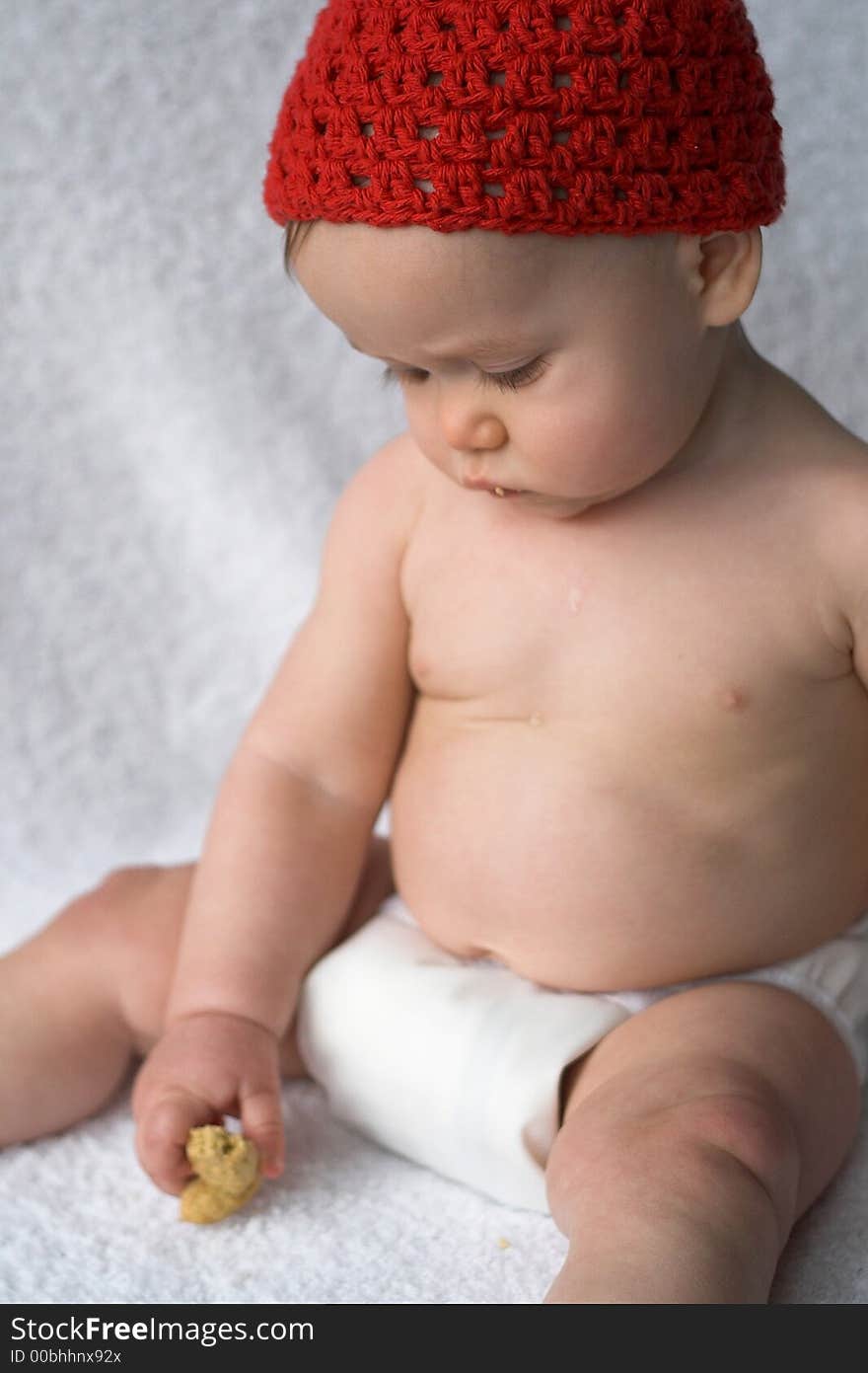 Image of baby eating a cookie. Image of baby eating a cookie