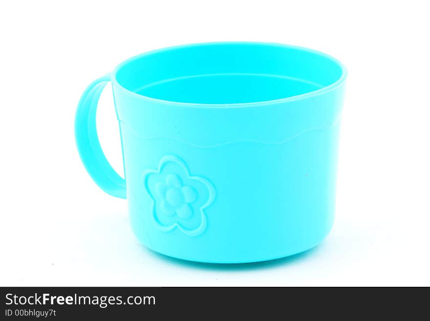 A blue toy tea cup. A blue toy tea cup