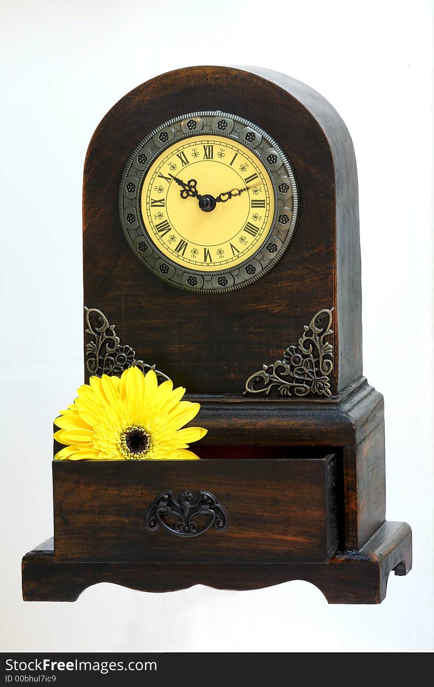 Clock with a wooden drawer as bottom. Clock with a wooden drawer as bottom.