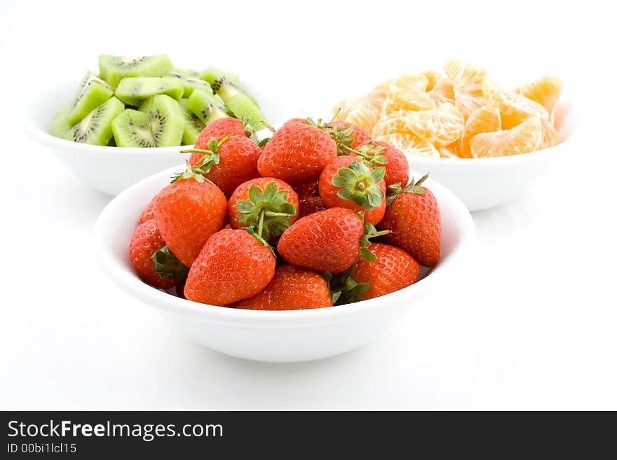 Kiwi, Strawberry And Mandarine, Tangerine In White Bowls