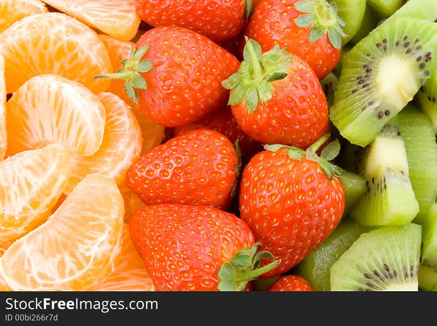 Mandarine, strawberry and kiwi, three colour composition, healthy diet, low fat, low calorie