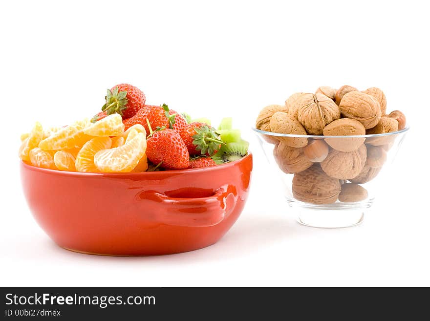 Kiwi, strawberry and mandarine, tangerine with mixed nuts on white background, isolated