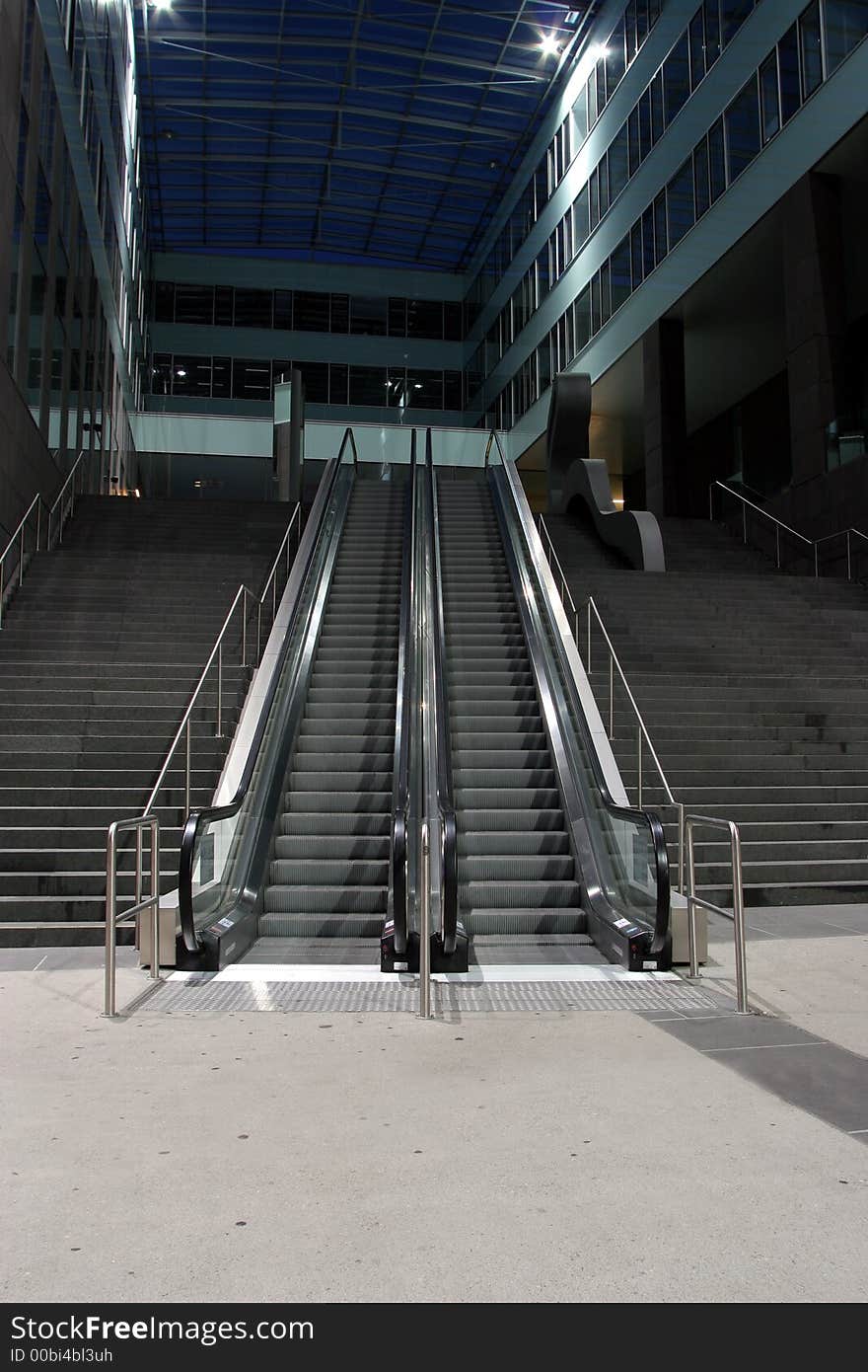 Escalators between stairs at night