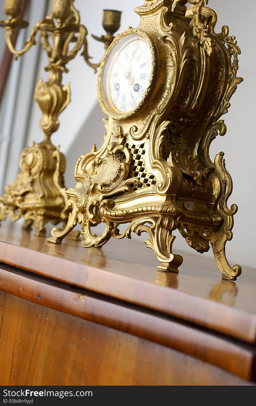 An old golden clock shallow depth of field