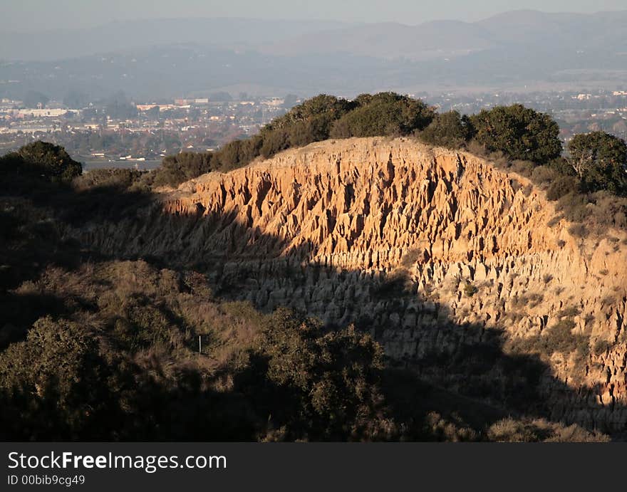 Orange colored dirt cliffs in California. Orange colored dirt cliffs in California