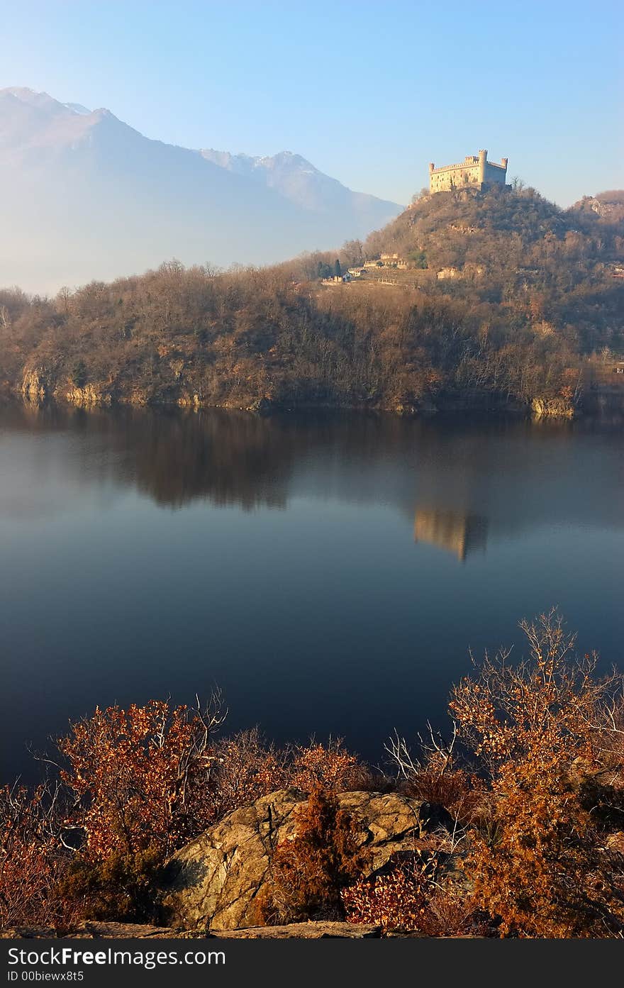 Ancient castle reflected in an alpine lake, Ivrea, north Italy. Ancient castle reflected in an alpine lake, Ivrea, north Italy.