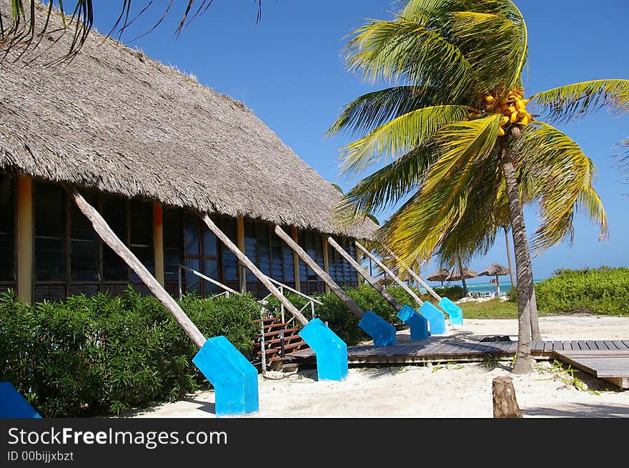 Cabana with thatched roof in tropical setting. Cabana with thatched roof in tropical setting