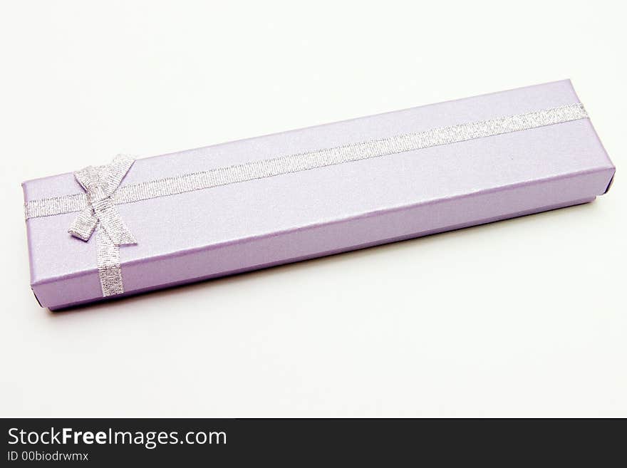 Gift Box with Silver Ribbon against White background