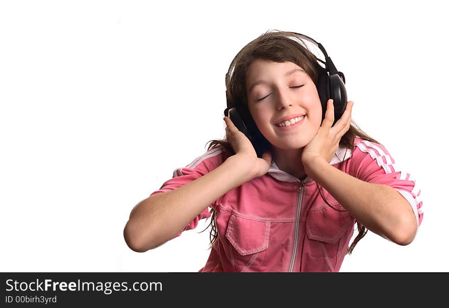 The girl listens to music in headphones